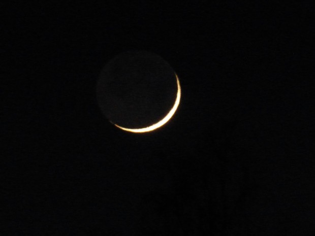 First sliver of waxing moon (6:28 pm, 1.21.15, Anchorage, Ak)