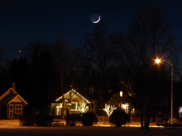 First sliver of waxing moon over the Park Strip (6:28 pm, 1.21.15, Anchorage, Ak)